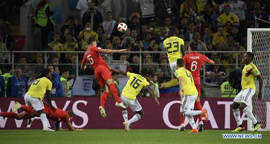 Harry Kane (2nd L) of England is fouled by Carlos Sanchez (1st L) of Colombia resulting in a penalty during the 2018 FIFA World Cup round of 16 match between England and Colombia in Moscow, Russia, July 3, 2018. (Xinhua/Lui Siu Wai)