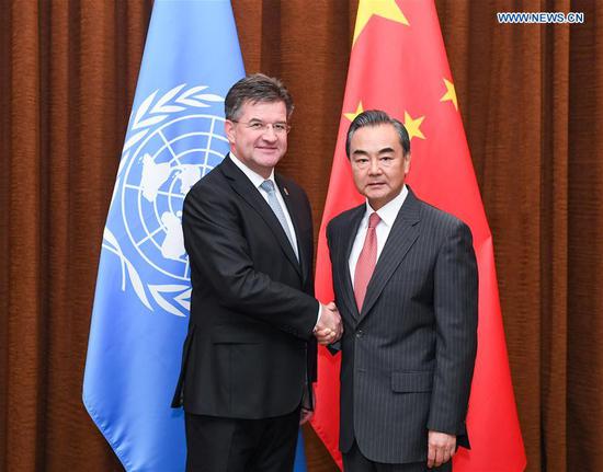 Chinese State Councilor and Foreign Minister Wang Yi (right) holds talks with President of the 72nd session of the UN General Assembly Miroslav Lajcak in Beijing, capital of China, July 3, 2018. (Photo/Xinhua)