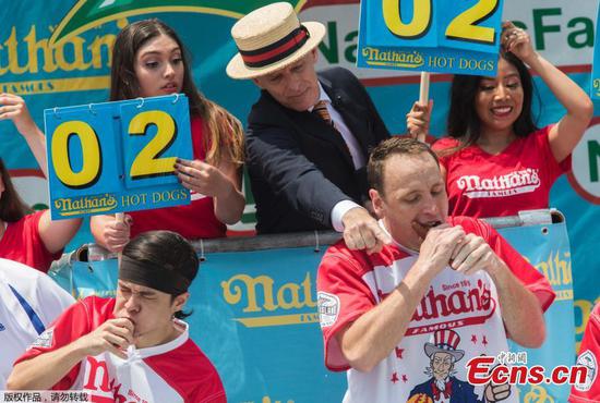 Joey Chestnut devours record 74 hot dogs for 11th win at Nathan's Famous contest 