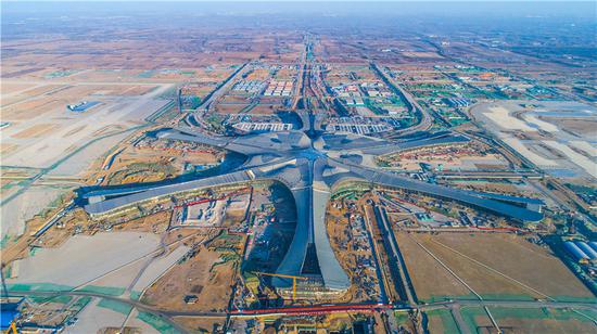 An aerial photo shows the construction site of Beijing's new airport in southern Daxing district in Beijing. (Photo by Yang Zhiyong/chinadaily.com.cn)