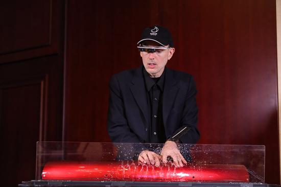 Steve Mann, the Canadian inventor known as “the father of wearable computing” is playing the hydraulophone – the world’s first musical instrument to make sound from vibrations in liquids he invented, on the sidelines of the 2018 Silicon Valley Innovation and Entrepreneurship Forum in Beijing, July 3, 2018. /CGTN Photo
