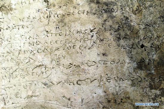 Photo taken on July 10, 2018 in Greece shows the clay tablet with an engraved inscription clearly showing 13 verses from Homer's Odyssey. A Roman-era clay tablet with an engraved inscription clearly showing 13 verses from Homer's Odyssey was unearthed in Ancient Olympia by archaeologists, the Greek Culture Ministry announced on Tuesday. (Xinhua/Greek Culture Ministry)