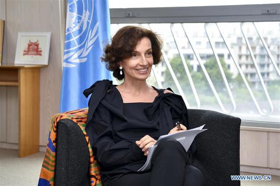 UNESCO Director-General Audrey Azoulay poses for photos at UNESCO headquarters in Paris, France, on July 13, 2018. From July 16 to 19, Azoulay will make her first visit to China as Director-General of UNESCO. (Xinhua/Chen Yichen)