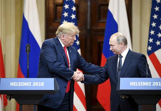 U.S. President Donald Trump (L) shakes hands with Russian President Vladimir Putin during a joint press conference in Helsinki, Finland, on July 16, 2018. Donald Trump and Vladimir Putin started their first bilateral meeting here on Monday. (Xinhua/Lehtikuva/Jussi Nukari)