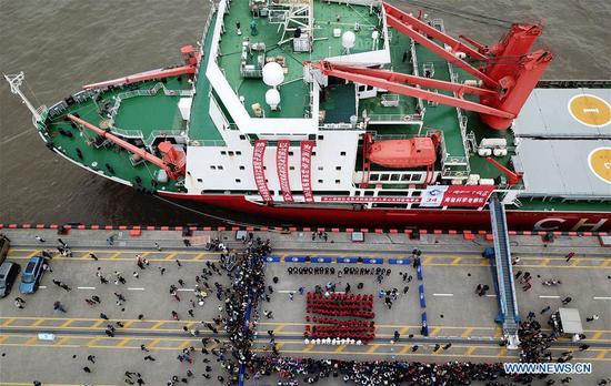 Aerial photo taken on April 21, 2018 shows members of China's 34th Antarctic expedition taking part in a welcoming ceremony on a dock in Shanghai, east China. (Xinhua/Fang Zhe)