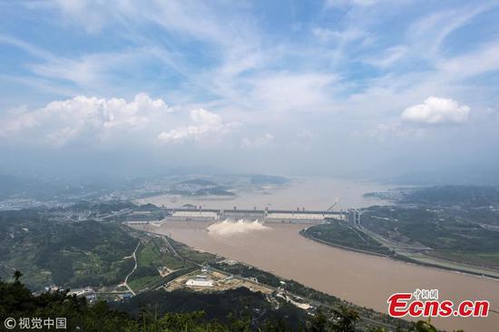 Water gushes out of the Three Gorges Dam in Yichang City, Central China’s Hubei Province. On July 14, the Three Gorges Reservoir will receive a massive 60, 000 cubic meters of water a second due to heavy rain in the upper reaches of the Yangtze River. Authorities have issued a flood alert in several provinces along the river. (Photo/VCG)