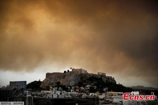 Greek wildfire kills at least 20 near Athens, residents flee homes