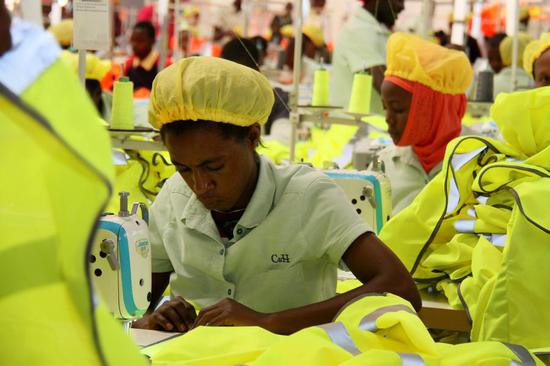Rwandan workers make clothing at C&H, a Chinese garment factory in Kigali, the capital. The factory, which opened in 2015, employs about 1,200 workers, all of whom are locals. (Photo/Xinhua)