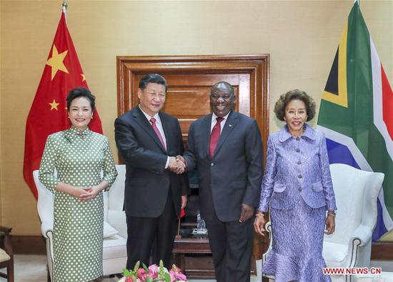 Chinese President Xi Jinping (2nd L) and his wife Peng Liyuan (1st L) pose for photos with South African President Cyril Ramaphosa (2nd R) and his wife Tshepo Motsepe ahead of the two leaders' talks in Pretoria, South Africa, July 24, 2018. (Xinhua/Xie Huanchi)