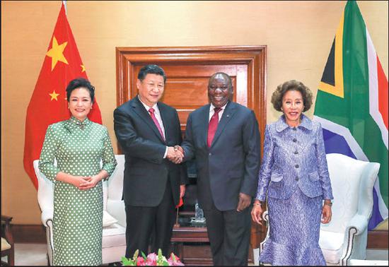 President Xi Jinping meets with his South African counterpart, Cyril Ramaphosa, in Pretoria, South Africa, on Tuesday. They are accompanied by Xi's wife, Peng Liyuan, and Ramaphosa's wife, Tshepo Motsepe. (Photo: Xie Huanchi / Xinhua)