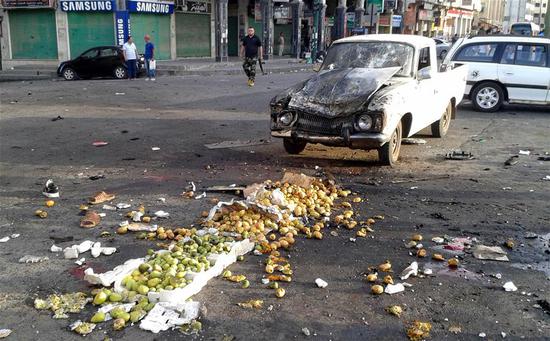 Fruits are seen scattered on the ground after a suicide bombing in Sweida, in southern Syria, on July 25, 2018. (Xinhua Photo)