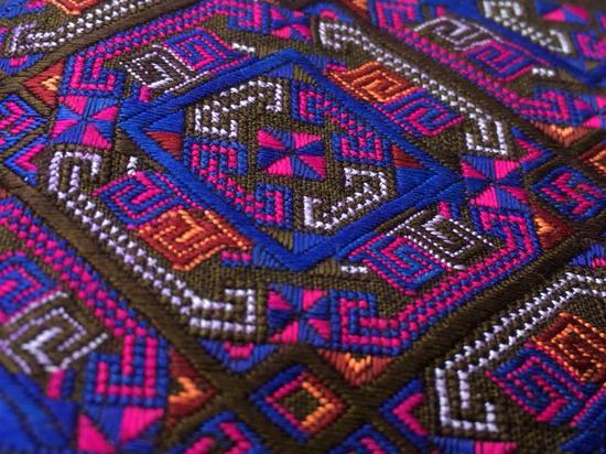 A single piece of embroidery takes as long as four months to finish. (Photo / CGTN)