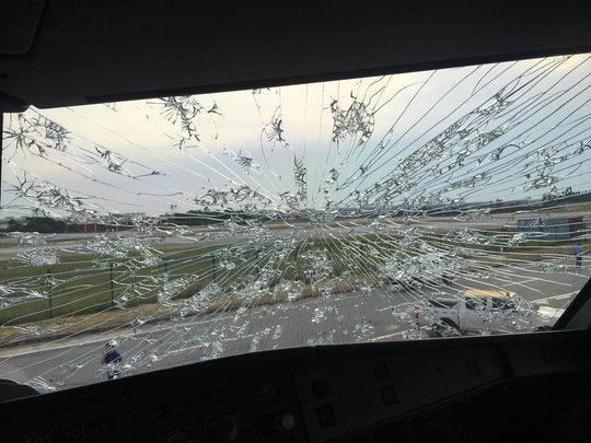 The windshields are cracked after the plane was hit by hail, July 26, 2018. (Photo from web)