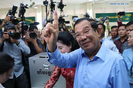 Cambodian Prime Minister Samdech Techo Hun Sen gestures after casting his ballot at a polling station in Kandal province, about 15 km south of capital Phnom Penh, Cambodia, on July 29, 2018. The sixth general election kicked off in Cambodia on Sunday with a total of 20 political parties taking part in the race, a National Election Committee (NEC) spokesman said. (Xinhua/Mao Pengfei)