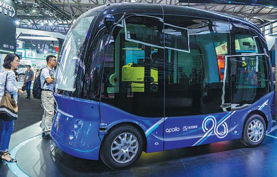 A Baidu Apollo bus is displayed at the CES Asia 2018 in Shanghai. （Photo provided to China Daily）