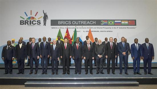 The BRICS leaders pose for a group photo with leaders or representatives of the leaders from invited countries, and heads of regional organizations in Africa in Johannesburg, South Africa, July 27, 2018. (Photo/XInhua)