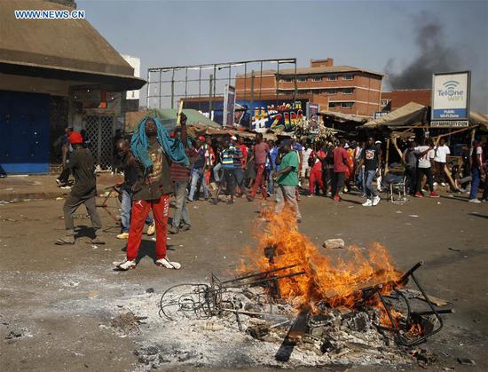 Supporters of the opposition MDC Alliance attend a protest in Harare, Zimbabwe, Aug. 1, 2018. Three people died and scores of others were injured Wednesday when protesting opposition supporters clashed with army and police in the capital Harare. (Xinhua/Shaun Jusa)