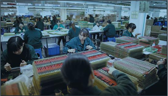 Laborers make pencils at the A.W. Faber-Castell stationery factory in Guangzhou, Guangdong Province, on Nov. 26, 2013. (Photo/CHINA DAILY)