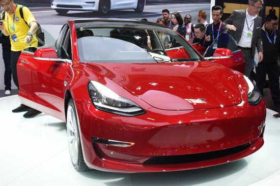 A Tesla Model 3 sedan is displayed during an auto expo in Beijing. (Photo provided to China Daily)