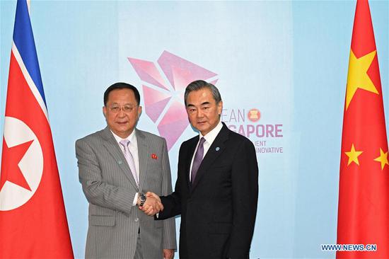Chinese State Councilor and Foreign Minister Wang Yi (R) meets with Foreign Minister of the Democratic People's Republic of Korea (DPRK) Ri Yong Ho in Singapore, Aug. 3, 2018. (Xinhua/Then Chih Wey)