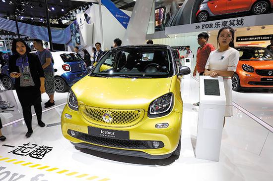Mercedes-Benz's smart forfour is displayed at an auto show in Beijing. The compact car offers more space and greater loading capacity to meet the needs of urban customers looking for something more than a two-seater vehicle. (Photo provided to China Daily)