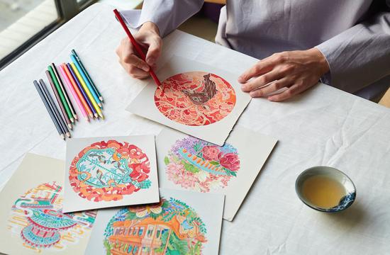 An artist works on a design for the Summer Palace. (Photo provided to China Daily)