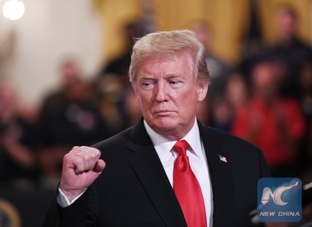U.S. President Donald Trump makes a gesture during the Pledge to America's Workers event at the White House in Washington, D.C., the United States, on July 19, 2018. (Xinhua/Liu Jie)