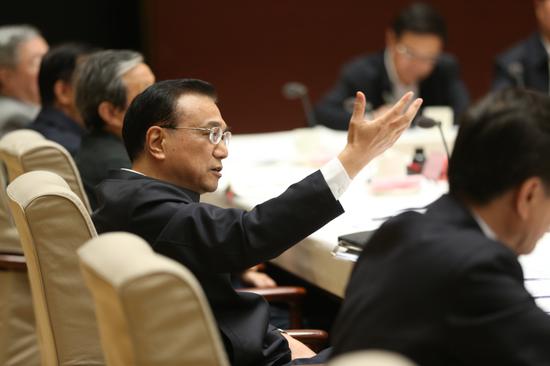 Premier Li Keqiang presides over a meeting on April 18, 2017. (Photo by Feng Yongbin/China Daily)