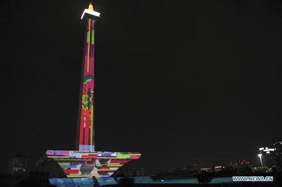 Video mapping projected on Indonesia's National Monument to welcome Asian Games