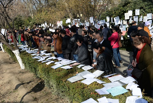 Parents gather in a matchmaking event to search for potential partners for their children./ Photo via Xinhua