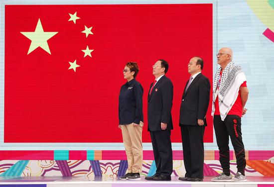 A flag-raising ceremony is held for Chinese athletes to the 18th Asian Games in Beijing, Aug. 16, 2018. (Photo: China News Service/Liu Guanguan)