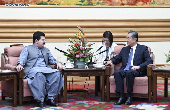 Chinese State Councilor and Foreign Minister Wang Yi (1st R) meets with Pakistan's Chairman of Senate Sadiq Sanjrani (1st L) in Beijing, capital of China, Aug. 16, 2018. (Xinhua/Zhang Ling)