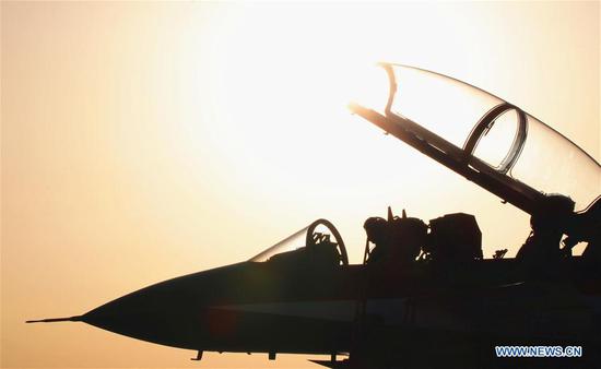 A J-10 fighter jet of the Chinese People's Liberation Army (PLA) Air Force's August 1st aerobatics team is seen at an airport in northwest China's Xinjiang Uygur Autonomous Region, Aug. 16, 2018. (Xinhua/Yu Yongde)