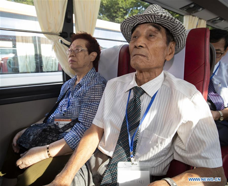 The South Korean separated families take a bus at Sokcho, South Korea, Aug. 20, 2018. A group of South Korean families separated by the 1950-53 Korean War from relatives living in the Democratic People's Republic of Korea (DPRK) left Monday morning for Mount Kumgang in southeast DPRK for rare reunions with their long-lost relatives. (Xinhua/Lee Sang-ho)
