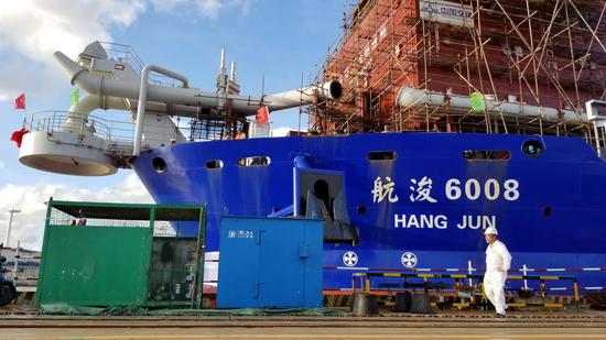 One land reclamation vessel seen in dock, with its long cannon-like pipe (CGTN Photo)