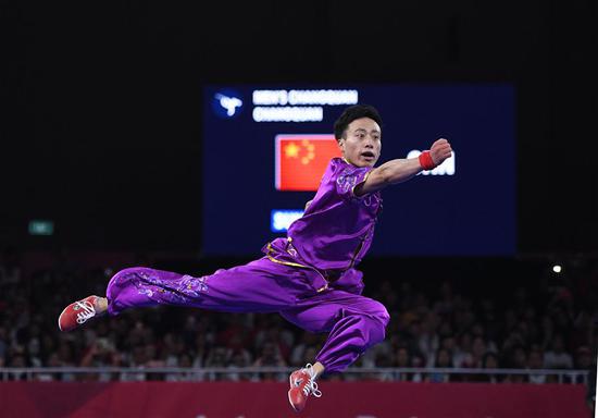 Sun Peiyuan of China competes during the Men's Changquan final at the 18th Asian Games in Jakarta, Indonesia Aug. 19, 2018. (Xinhua/Li Xiang)