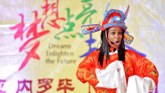 A student from Confucius Institute of Nairobi University performs Huangmei Opera during the 15th Chinese Bridge Chinese Proficiency Competition for Foreign College Students Kenya Division in Nairobi, Kenya, May 23, 2016. /Xinhua Photo