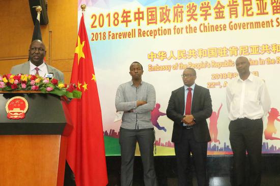 Chairman Rotich introduces members of the alumni association, including Joseph Maritim, first right. (Liu Hongie/China Daily)