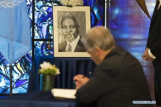 United Nations Secretary-General Antonio Guterres signs a book of condolences in memory of the late former Secretary-General Kofi Annan, at the UN headquarters in New York, Aug. 22, 2018. (Xinhua/Li Muzi)