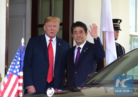 U.S. President Donald Trump (1st L) welcomes Japanese Prime Minister Shinzo Abe (2nd L) at the White House in Washington D.C., the United States, on June 7, 2018. (Xinhua/Yang Chenglin)