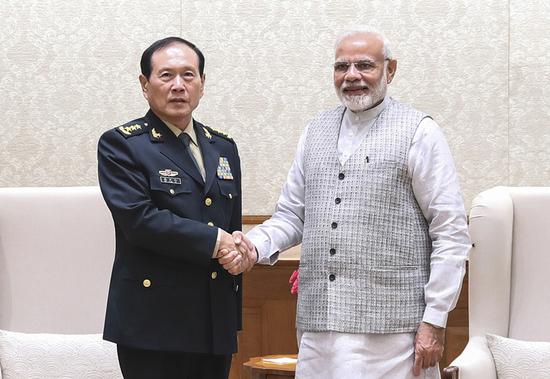 State Councilor and Defense Minister Wei Fenghe meets Indian Prime Minister Narendra Modi on Tuesday in New Delhi. (LI XIAOWEI/XINHUA)