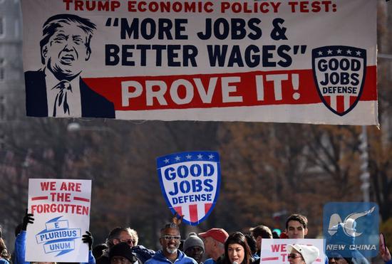 File photo taken on Dec. 7, 2016 shows people attending a rally calling for 