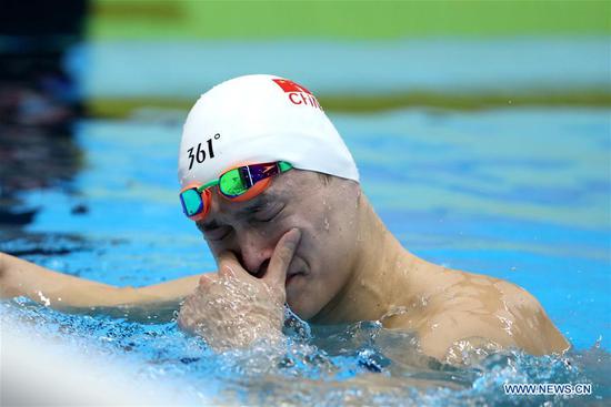 Sun Yang of China reacts after men's 1500m freestyle final of swimming at the 18th Asian Games in Jakarta, Indonesia, Aug. 24, 2018. Sun won the gold medal. (Xinhua/Fei Maohua)
