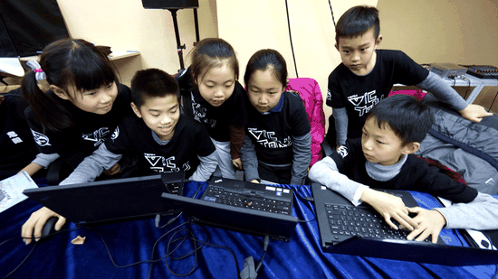 Children who are learning coding design games in a competition in Beijing. (Photo/Xinhua)
