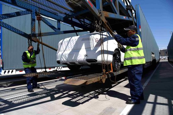 Vehicles manufactured in China are loaded in Daqing, Heilongjiang province, to be exported to the U.S. (Photo/Xinhua)