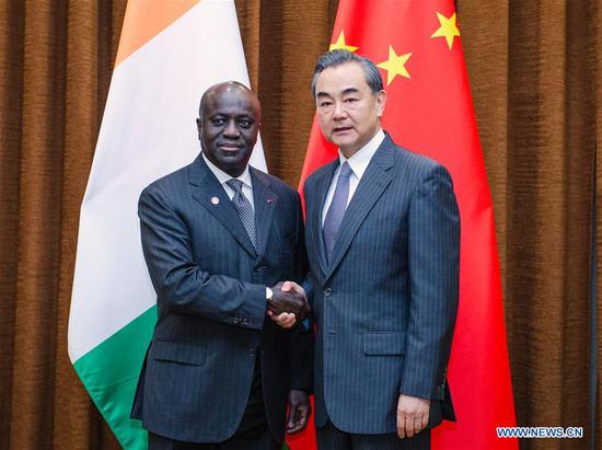 Chinese State Councilor and Foreign Minister Wang Yi (R) meets with Cote d'Ivoire's Foreign Minister Marcel Amon-Tanoh in Beijing, capital of China, Aug. 28, 2018. (Xinhua/Liu Bin)
