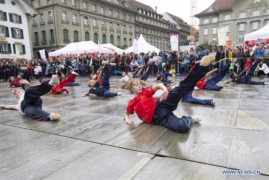 Local teenagers perform Chinese martial arts during the 