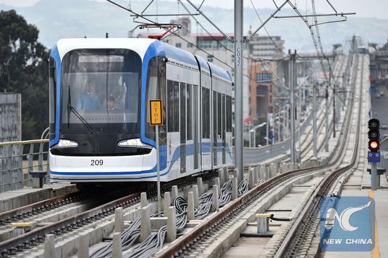 Photo taken on September 20, 2015 shows a train operating on the light rail in Addis Ababa, Ethiopia. /Xinhua Photo