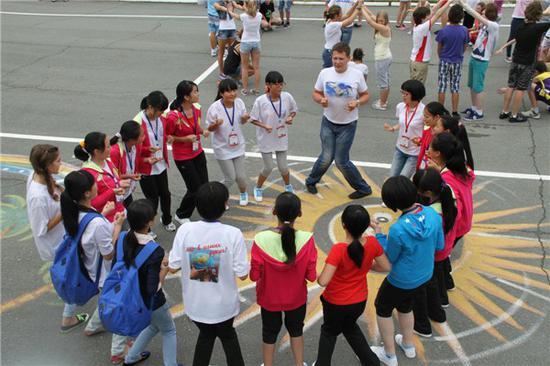 Chinese teenagers from Ya'an city in Southwest China's Sichuan province, which was hit by a large earthquake, join outdoor activities at the 