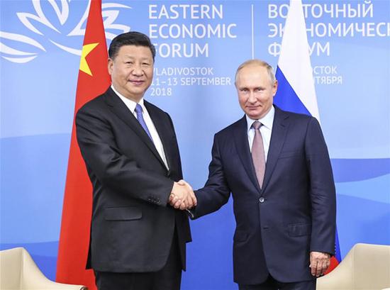 Chinese President Xi Jinping (L) holds talks with Russian President Vladimir Putin in Vladivostok, Russia, Sept. 11, 2018. (Xinhua/Xie Huanchi)